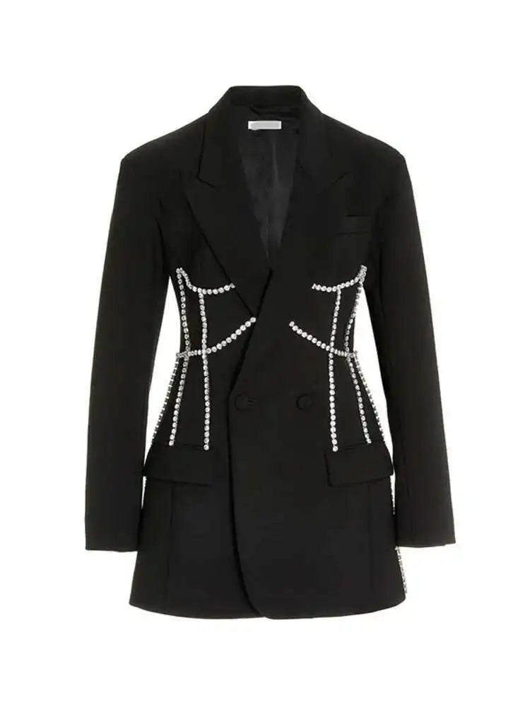 Silvarra A bold white blazer with silver chains.