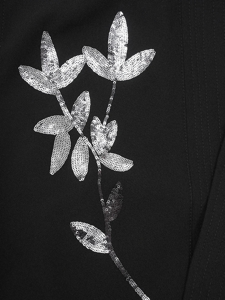 Karel  A bold floral sequin vest with a V-neck