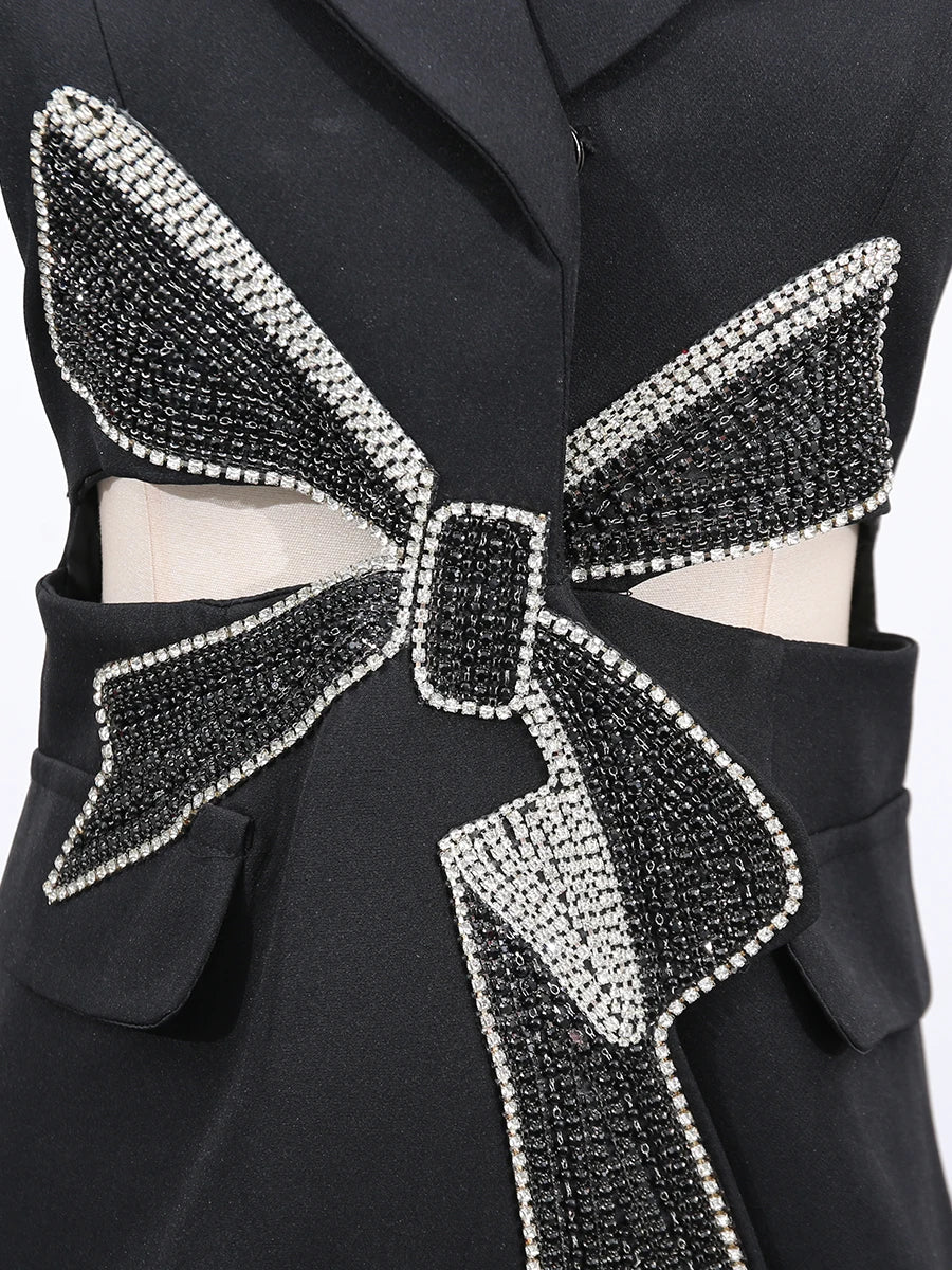 Seyna a bold, hollow-out black Blazer mini dress with sequin patchwork