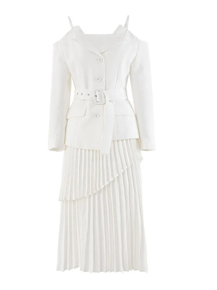 Elan two-piece set featuring a cold shoulder blazer with belt and pleated skirt